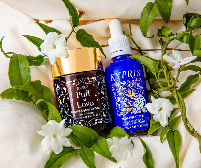 KYPRIS Puff of Love Moisturizer and Antioxidant Dew Serum with white flowers and green leaves