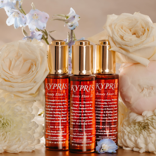 KYPRIS Beauty Elixir I, II, III bottles with floral backdrop