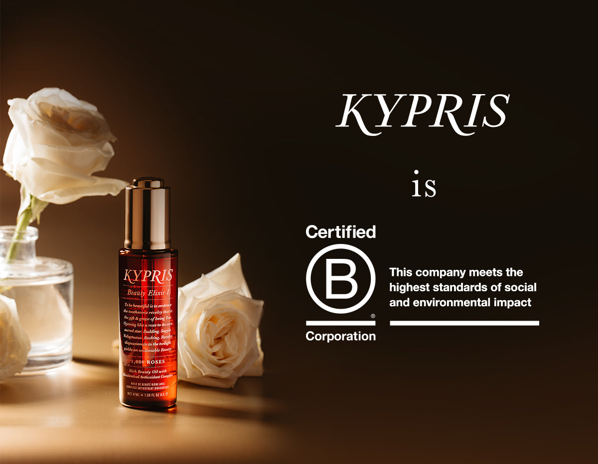 KYPRIS Beauty Elixir I with 1,000 Roses, Certified B Corporation, white roses beside bottle