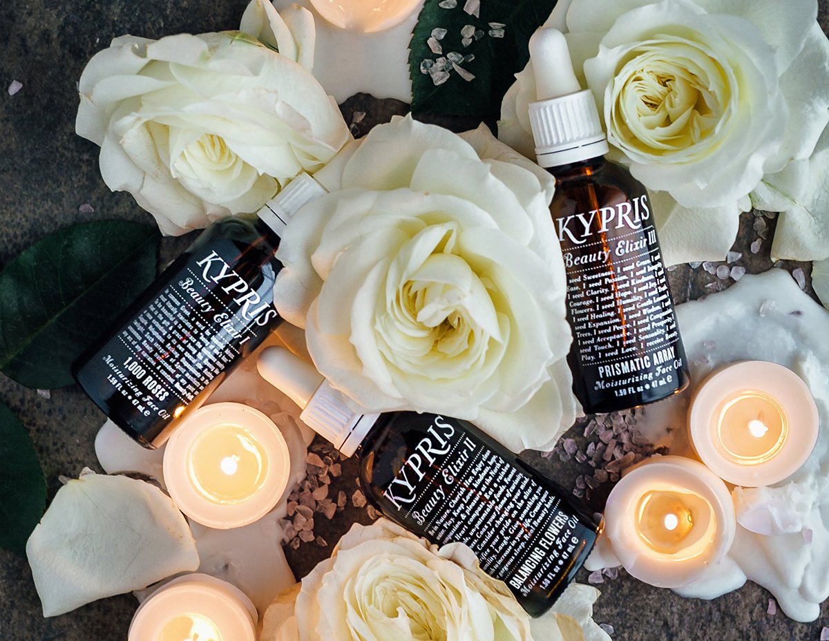 KYPRIS Beauty Elixir I, II, III moisturizing face oils with white roses, candles, and crystals