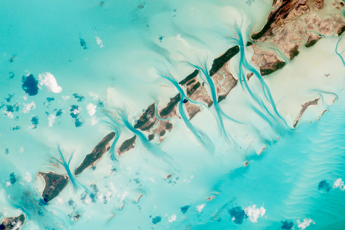Aerial view of turquoise waters and islands with intricate river patterns