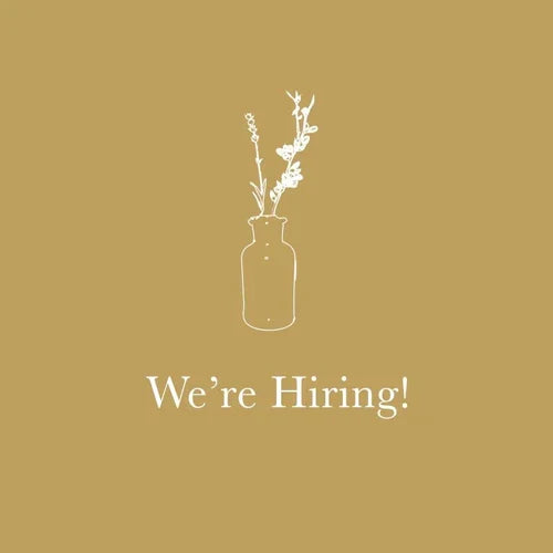 We're Hiring! with white floral illustration on gold background
