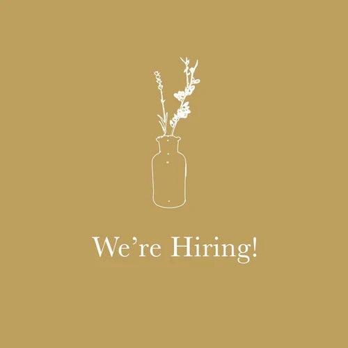 We're Hiring! with white floral illustration on gold background