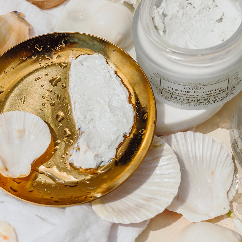 KYPRIS Pot of Shade Heliotropic SPF 30 UVA+UVB Sunscreen in gold dish with seashells