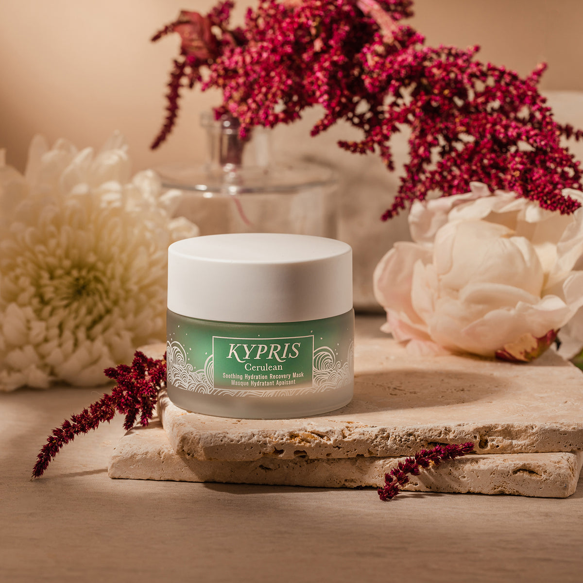 Cerulean Soothing Hydration Mask among red and white flowers