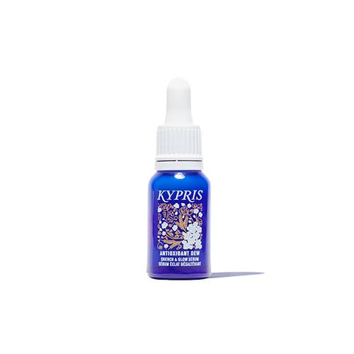Antioxidant Dew, in cobalt glass bottle, on white background.