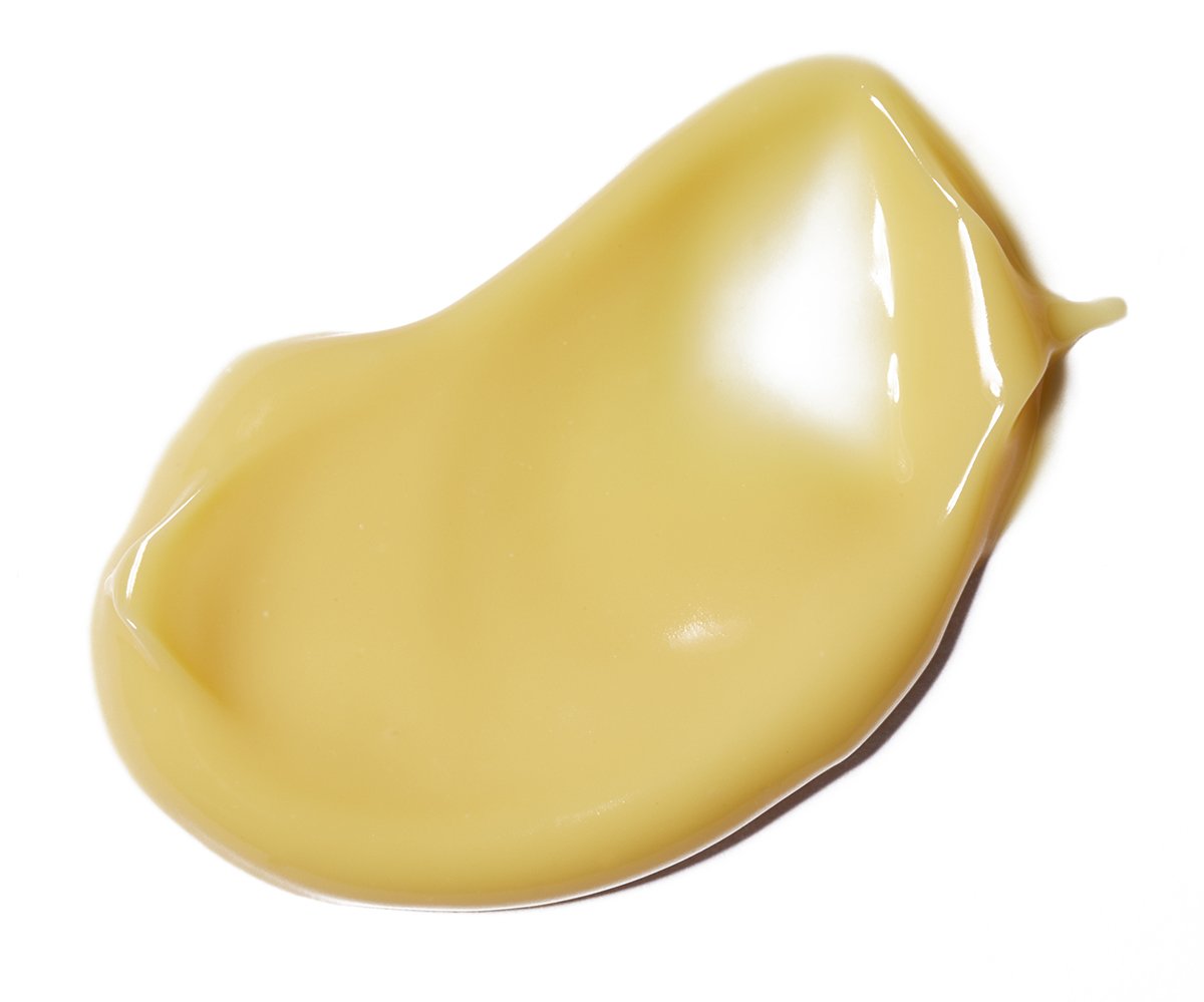 Puff of Love Nurturing Anytime Moisturizer golden yellow texture.