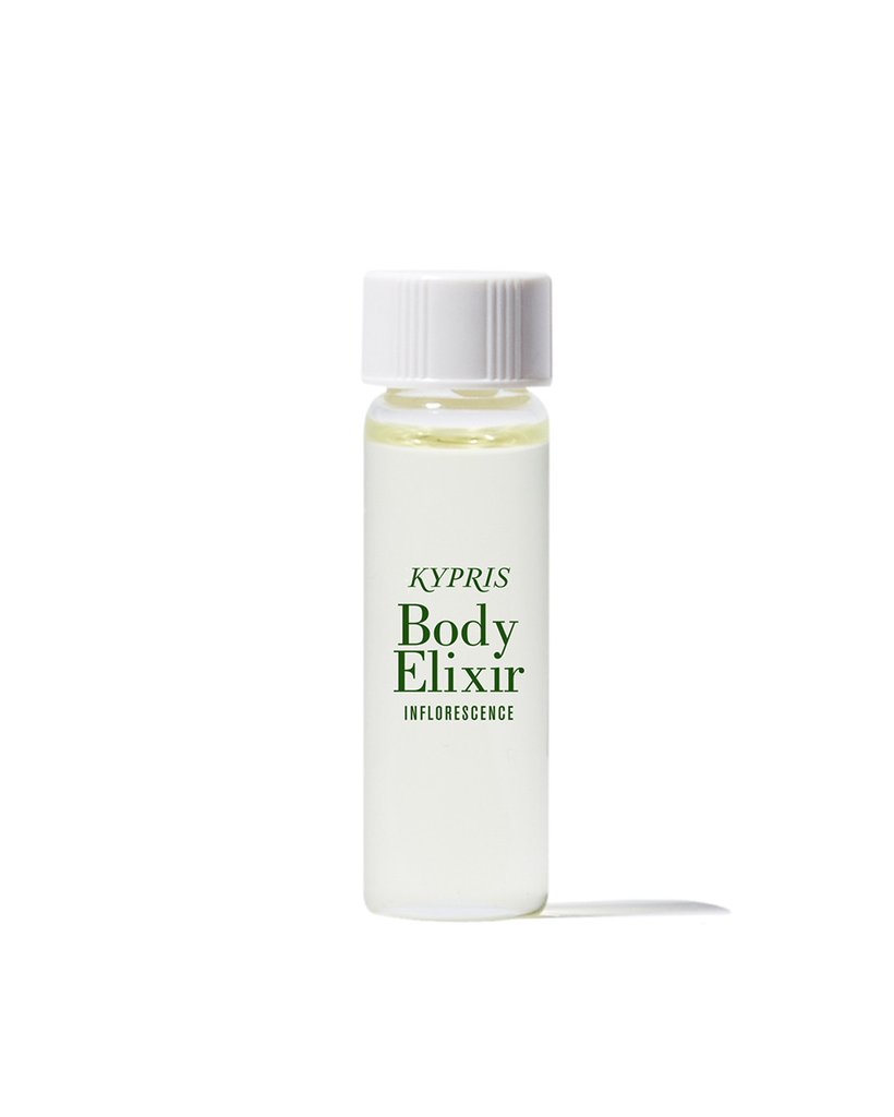 Body Elixir: Inflorescence body oil, in clear glass bottle with white cap, on white white background.