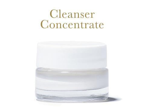 Cleanser Concentrate, in clear glass jar with white lid, on white background.