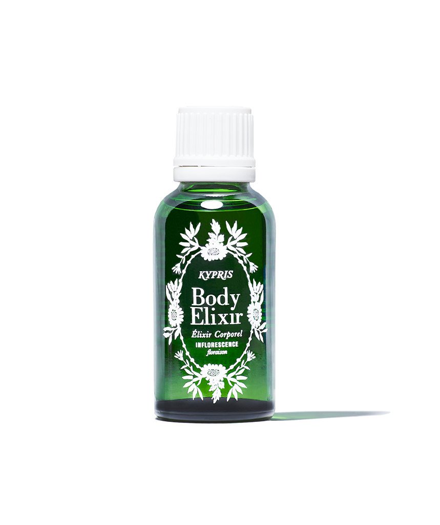 Body Elixir: Inflorescence body oil, in green glass bottle with white cap, on white white background.