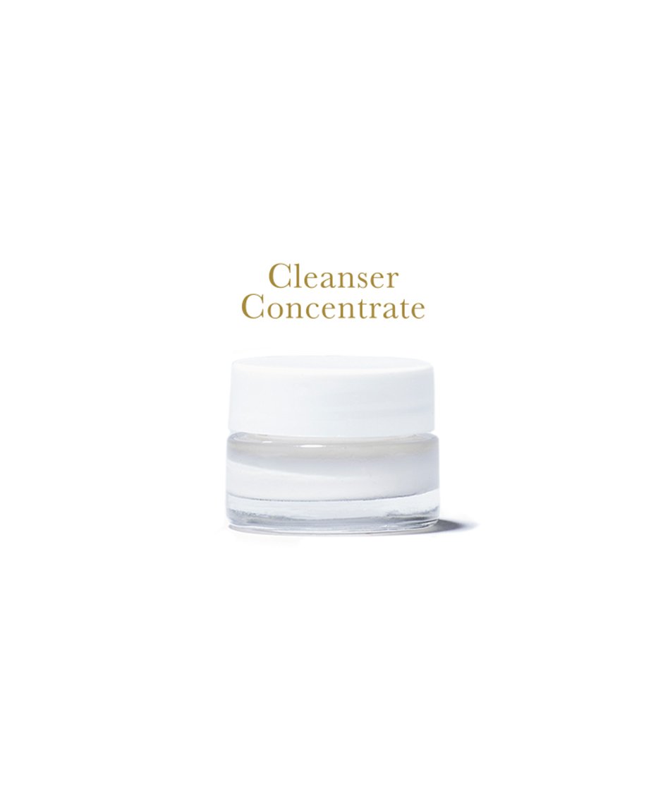 Cleanser Concentrate, in clear glass jar with white lid, on white background.