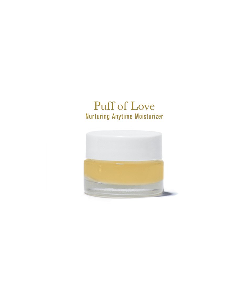 Puff of Love Moisturizer, in glass glass jar with white lid, on white background.